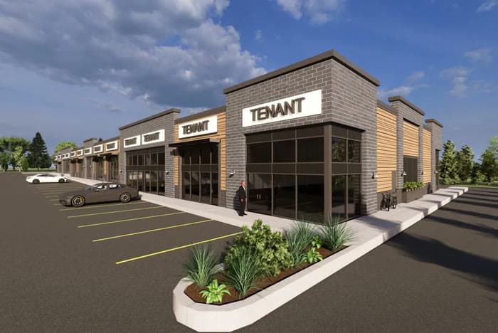Rendering of a commercial retail strip with a curbed landscape planter in the parking lot