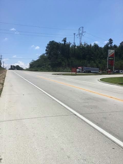 Paved shoulder along a divided highway near a truck stop