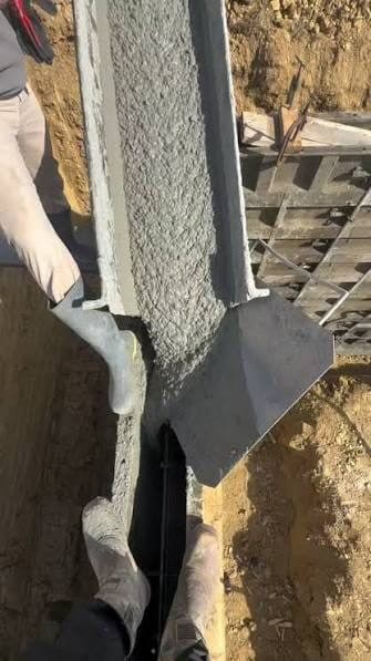 Flowable fill running from a mixer chute