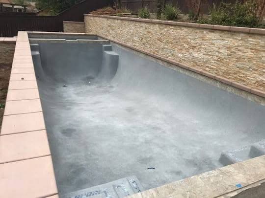 Finished pool shell with bond beam and coping