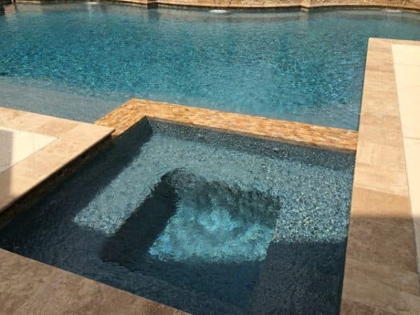 Tiled spa set into a pool